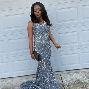 This is a Sequin formal dress in Gray . Have one split on the side